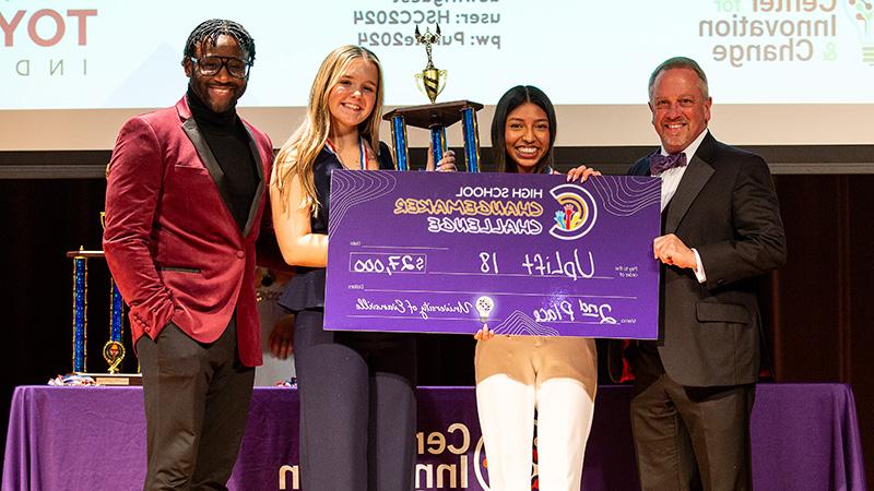 UpLift18 winners with giant check